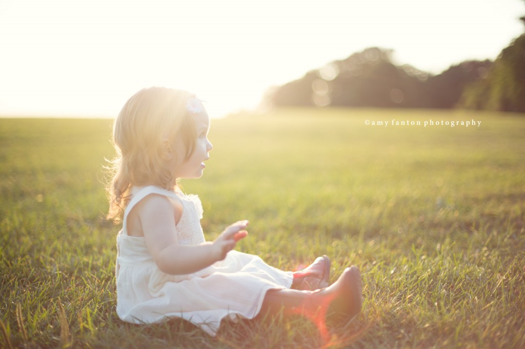Baby in Sunset on field