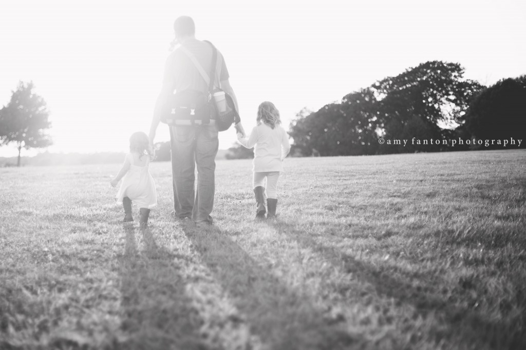 Dad walking with daughters 