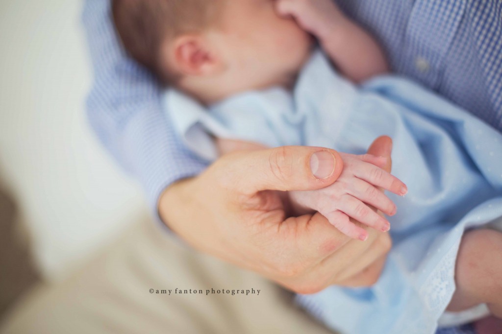 Baby in Fathers Arms Portrait